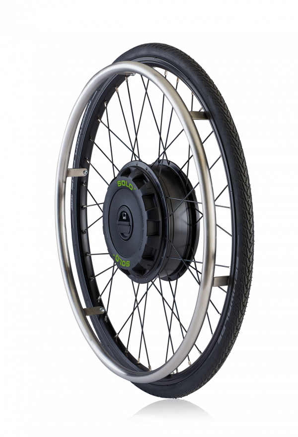 The picture shows the exposed wheel of the auxiliary drive SOLO on a white background. You can see the black wheel hub drive, with black spokes and a black wheelchair tire.